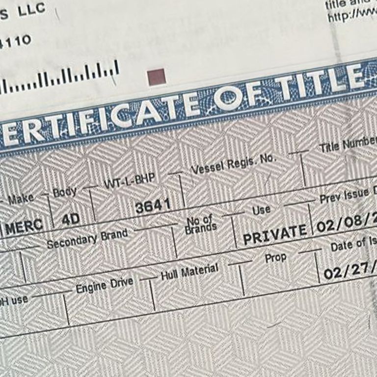A close up of a certificate of title for a boat