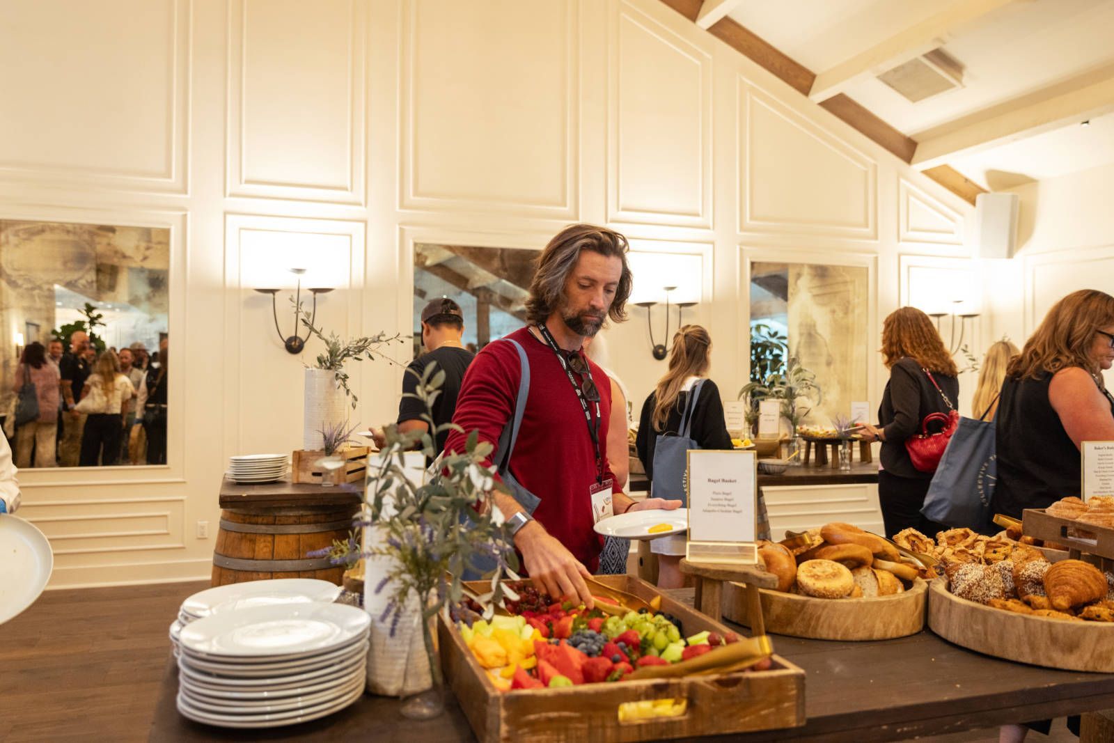 A man is standing in front of a buffet table.