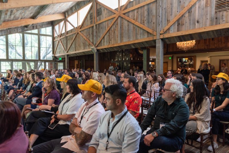 A large group of people are sitting in a room.