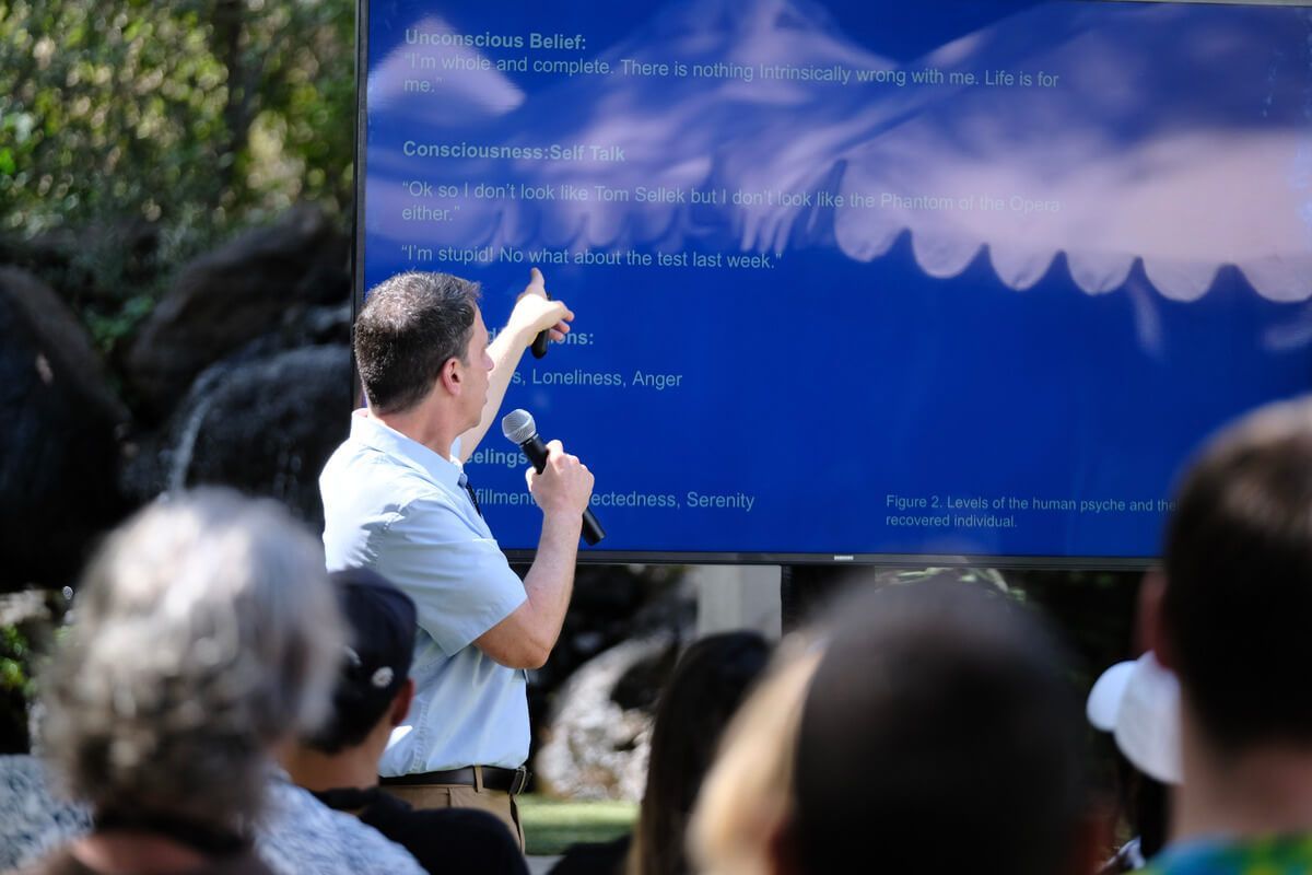 A man is giving a presentation to a group of people
