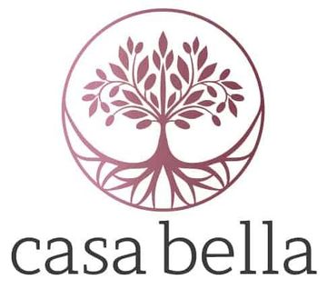 The logo for casa bella is a tree with roots in a circle.