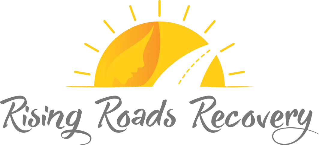 The logo for rising roads recovery shows a sun and a road.