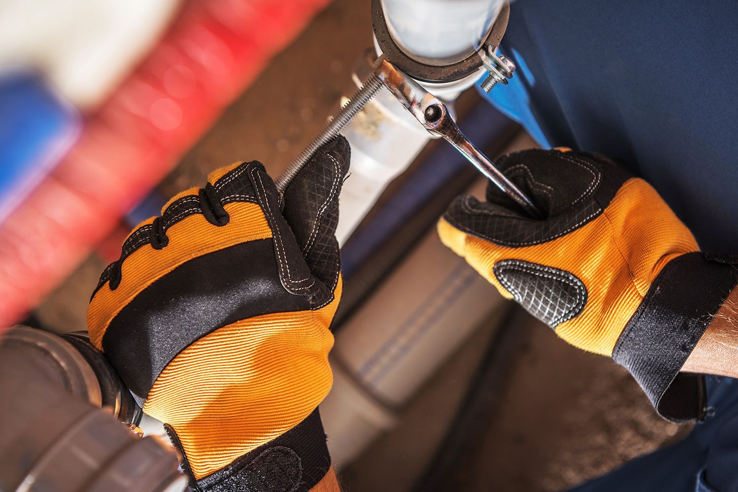 Professional Plumber Carefully Adjusting Water and Sewage System Components.