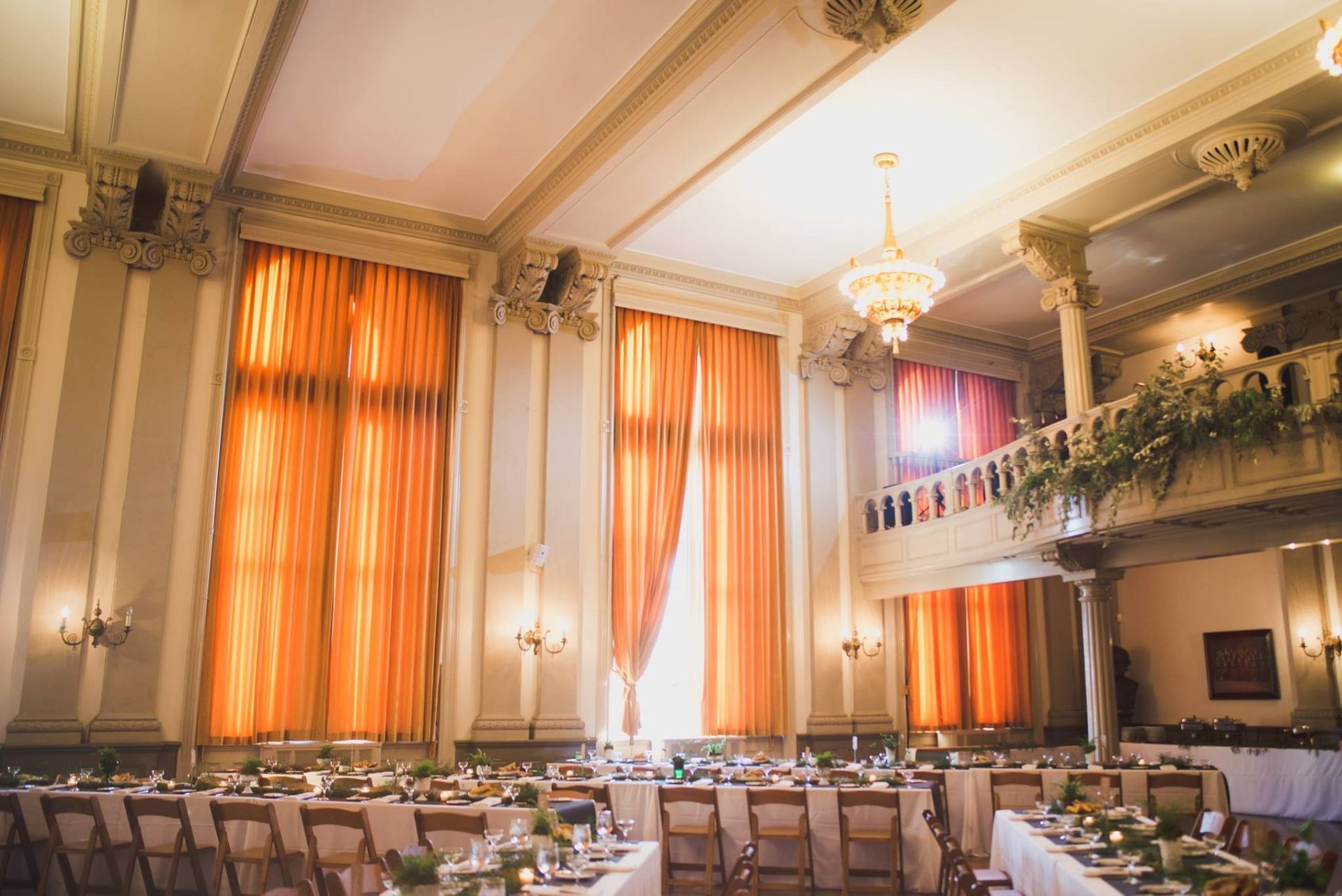 A large room with tables and chairs set up for a party