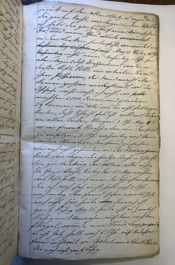 A book is open to a page with a lot of writing on it