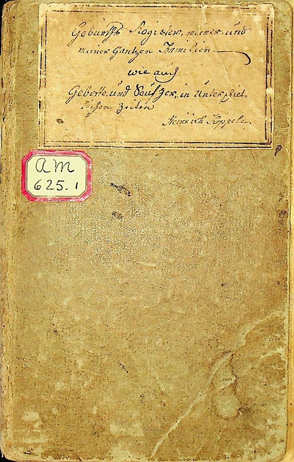 A very old book with a red sticker on the cover.