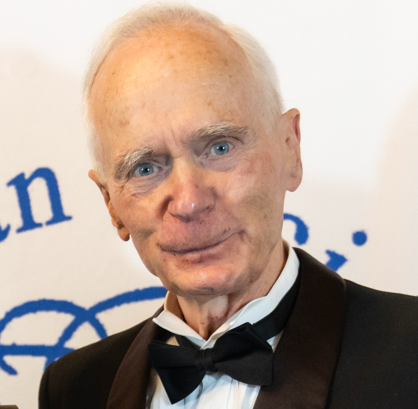 An man wearing a tuxedo and bow tie
