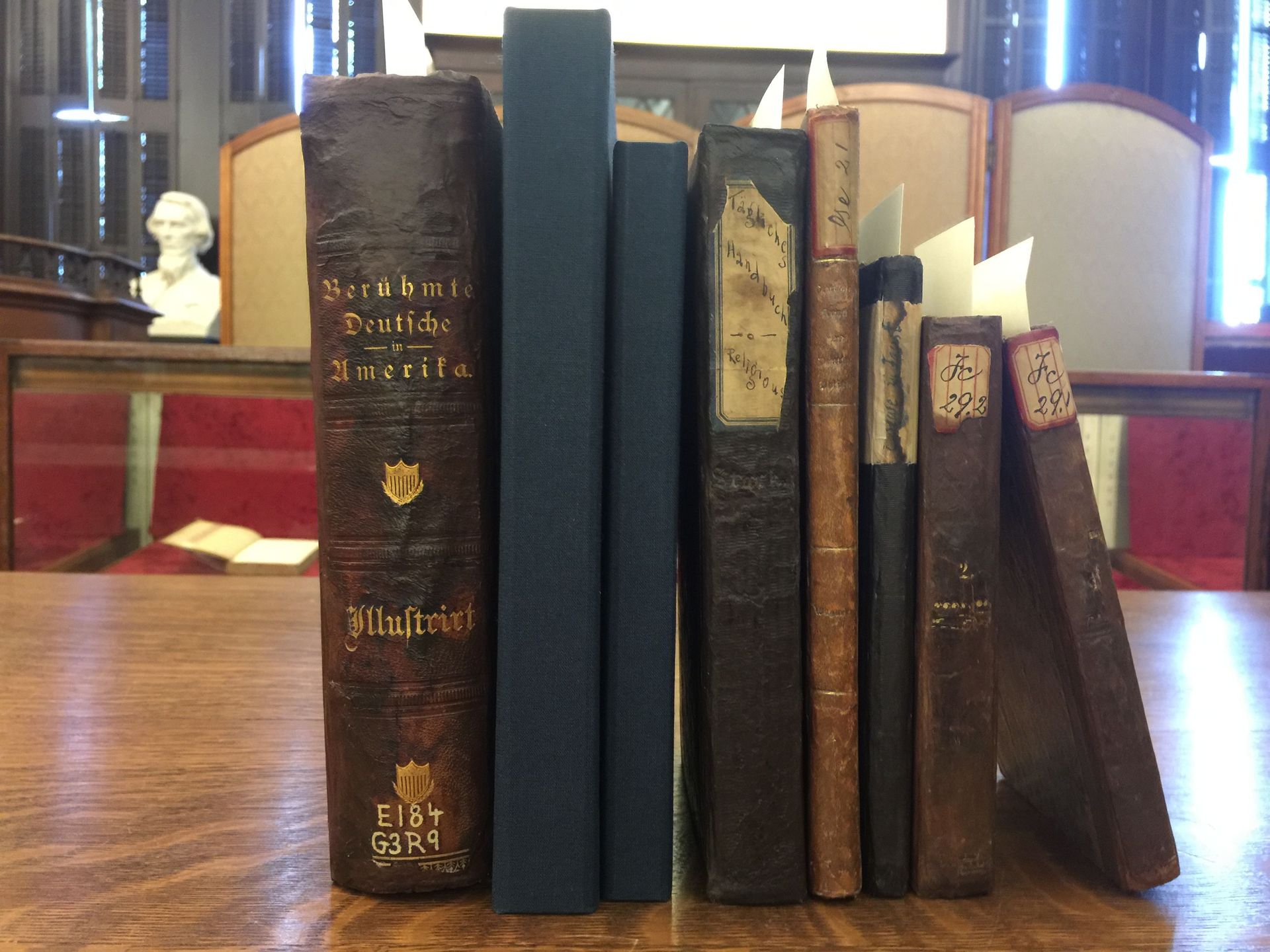 A row of books on a table one of which is titled ' execution '