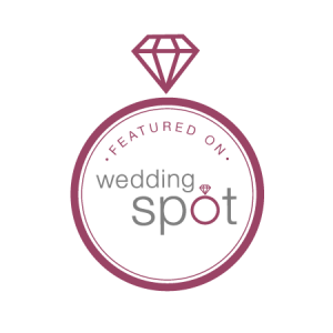 A wedding spot logo with a diamond in the center