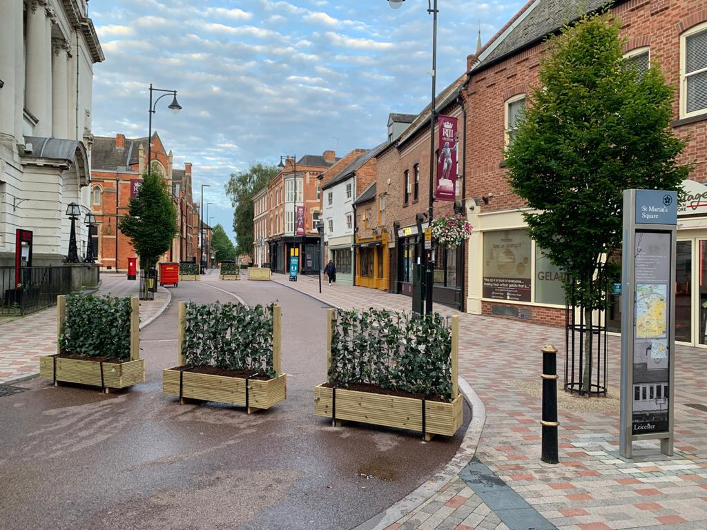3 timber planter boxes with 3 1 metre high green screens installed in Leicester city centre