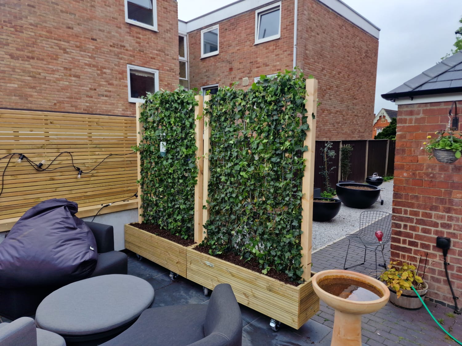 Mobilane green screens planted into timber planter boxes and delivered to reseidntial client.