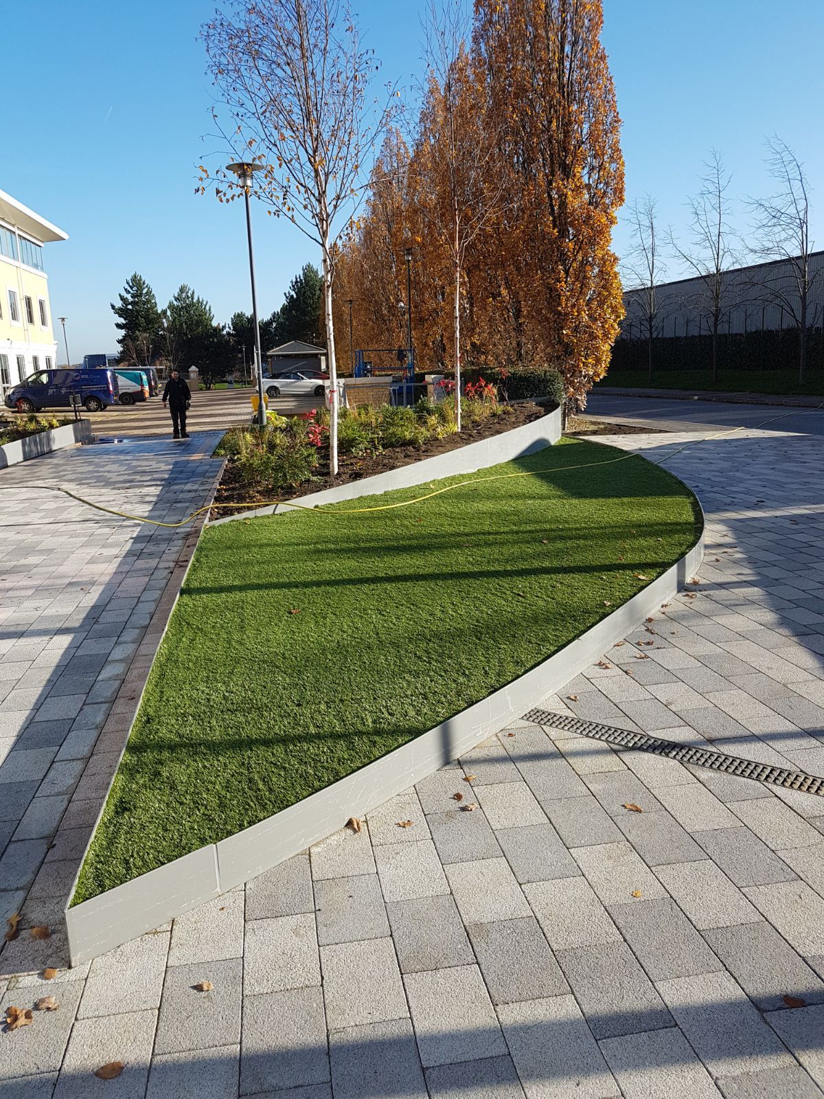 A soft landscaping project in London to include mature trees, planters and plants