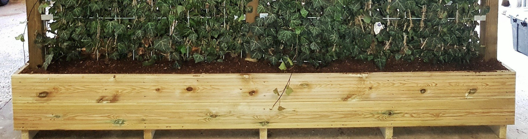 A bespoke timber planter box made on our premises, installed with or without a mobilane green screen