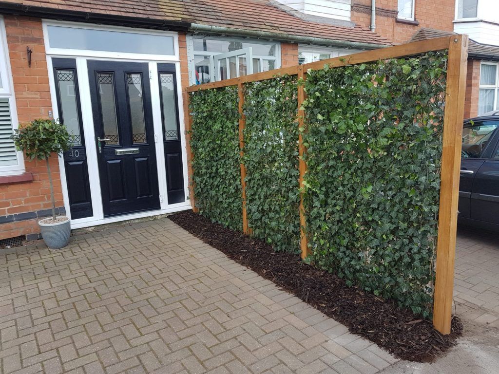 Mobilane ivy green screens installed into a bespoke timber frame for a residential client natural boundary fence