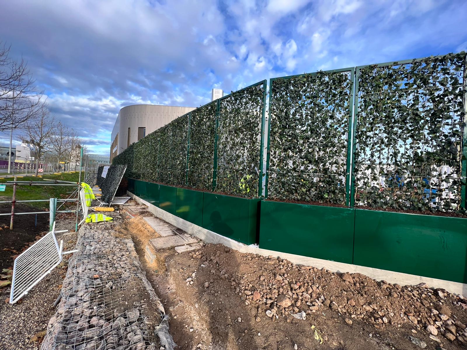 Mobilane green screens installed in powder coated steel planter boxes