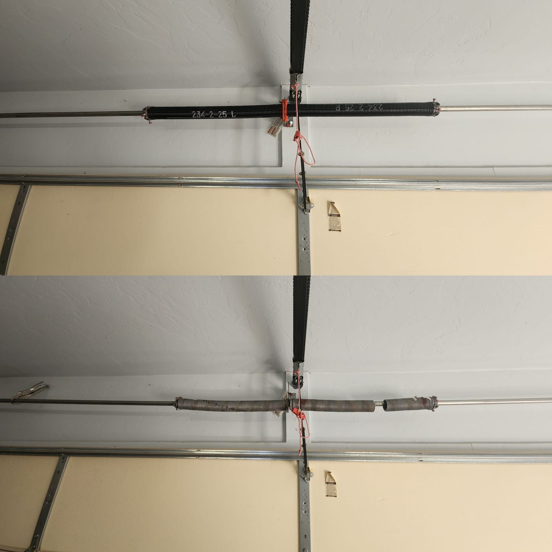 Gray garage door with window panels and stone accent.