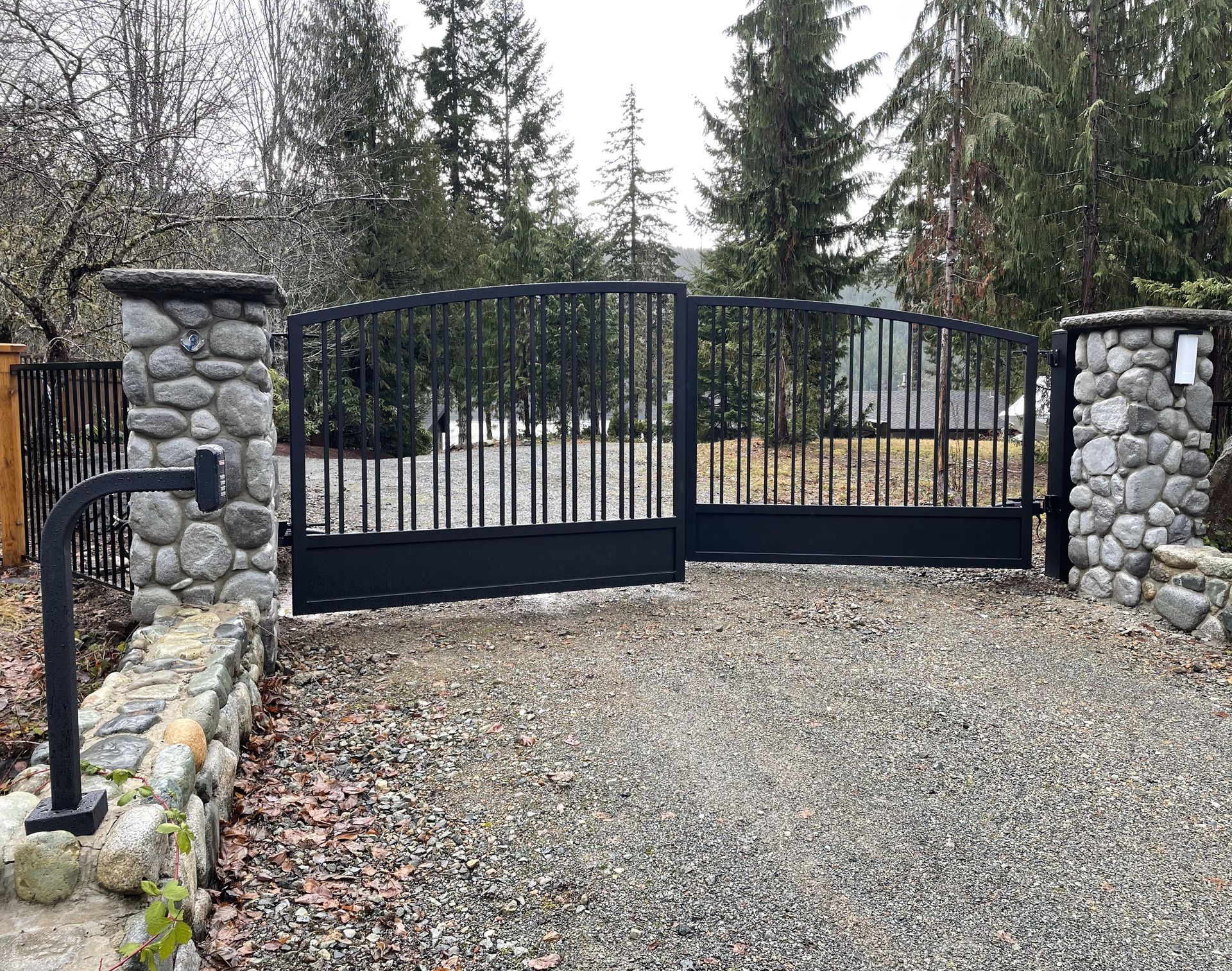 automated swing driveway gate on a rural piece of land