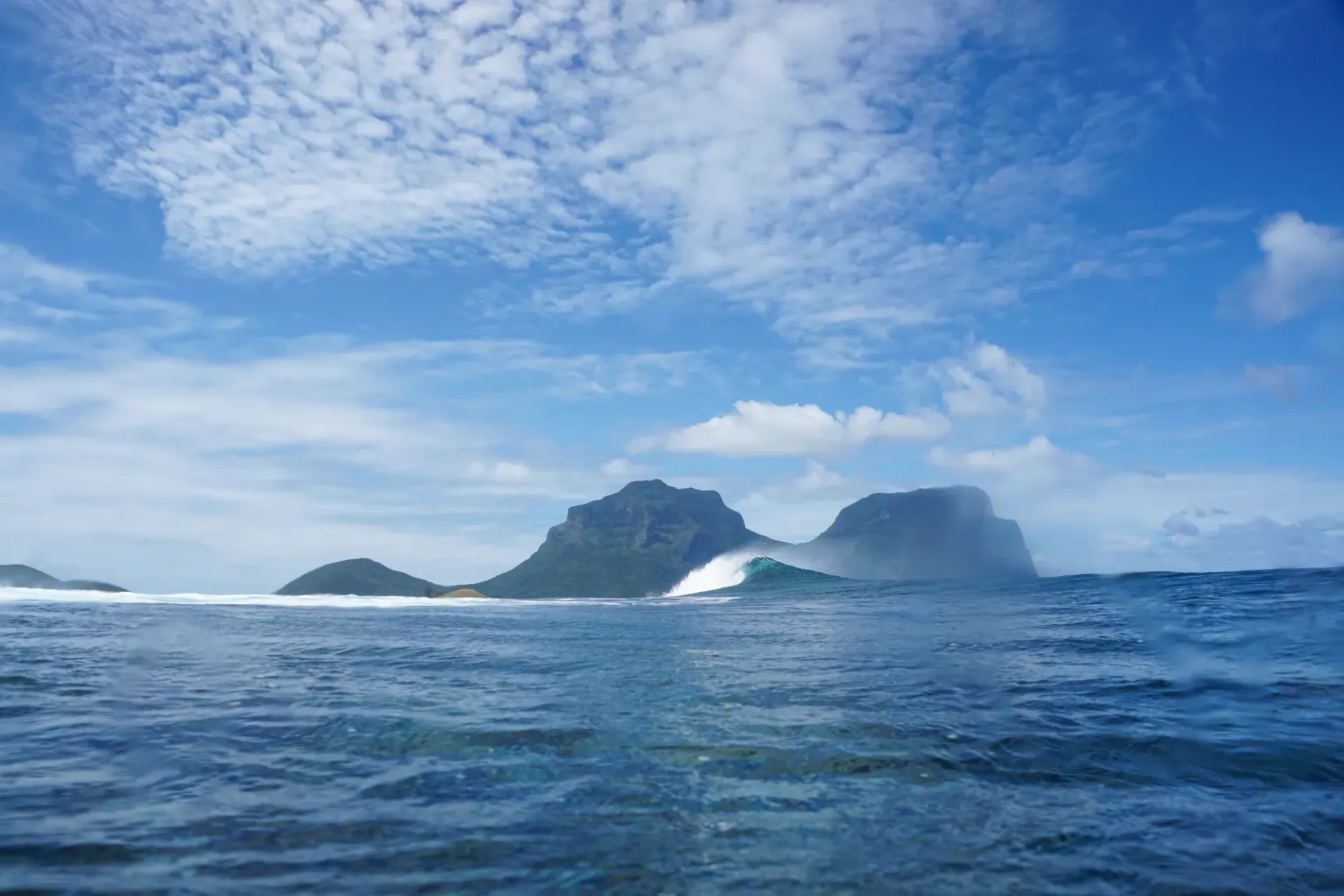 A large body of water with mountains in the background.