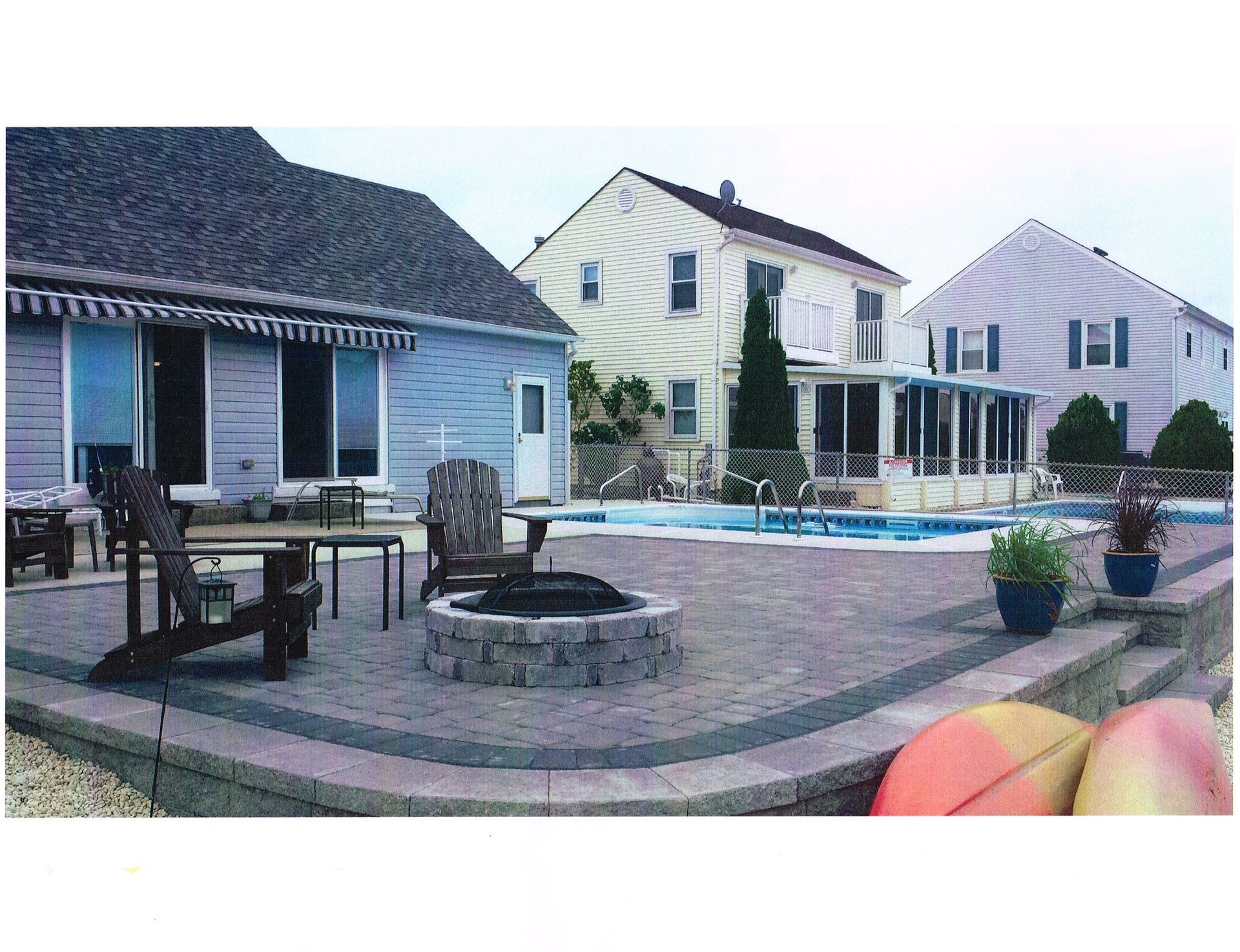 A house with a fire pit in front of it