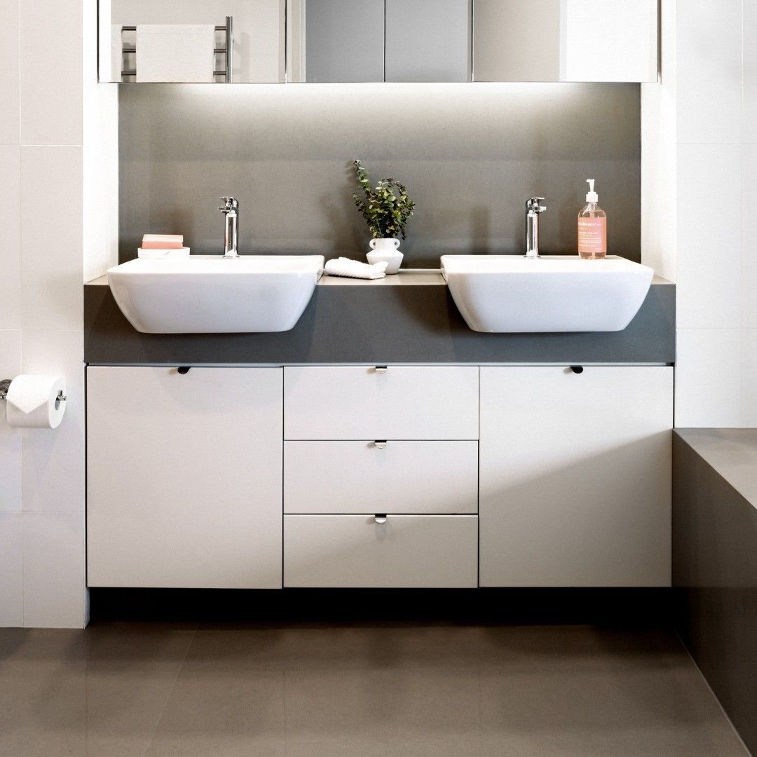 A Bathroom With Two Sinks And A Mirror — Wards Kitchens in Berkeley Vale, NSW