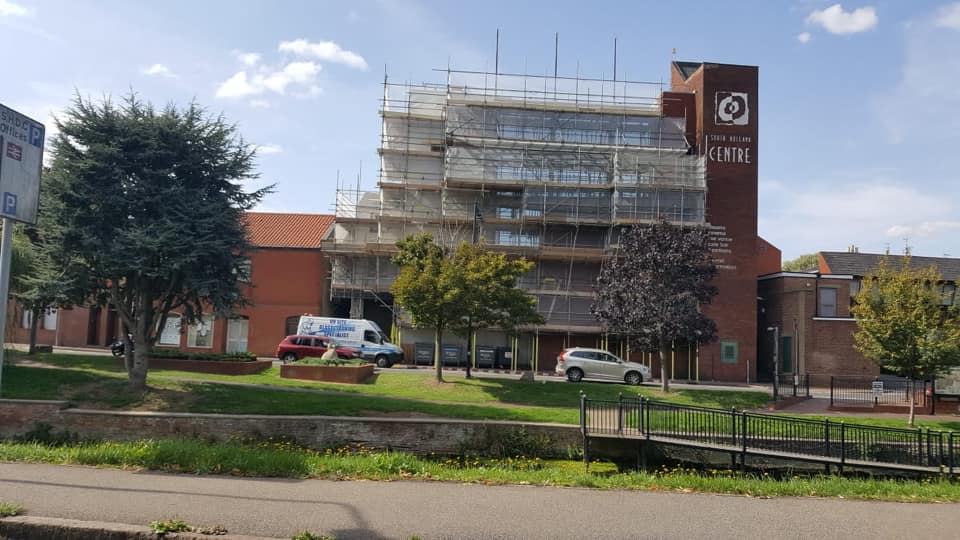 Large scaffolding covered and outside block of flats