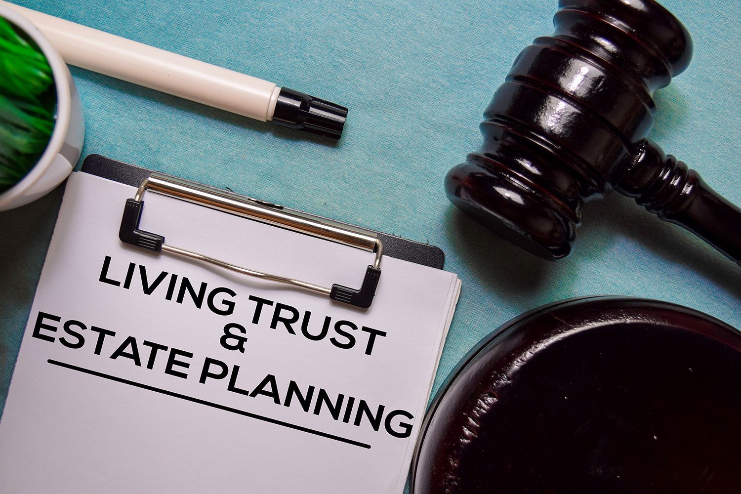 Living Trust & Estate Planning document with gavel on office desk.