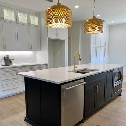 There is a large island in the middle of the kitchen.