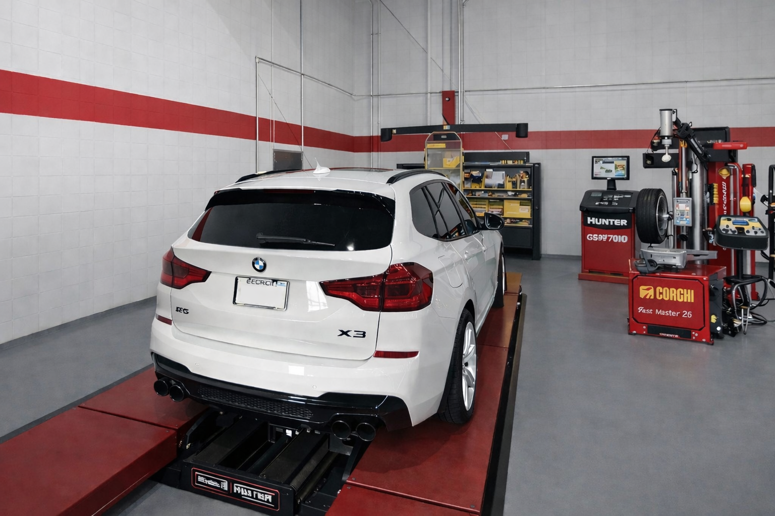 White SUV on an alignment rack in a car repair shop | Eastside Motoring