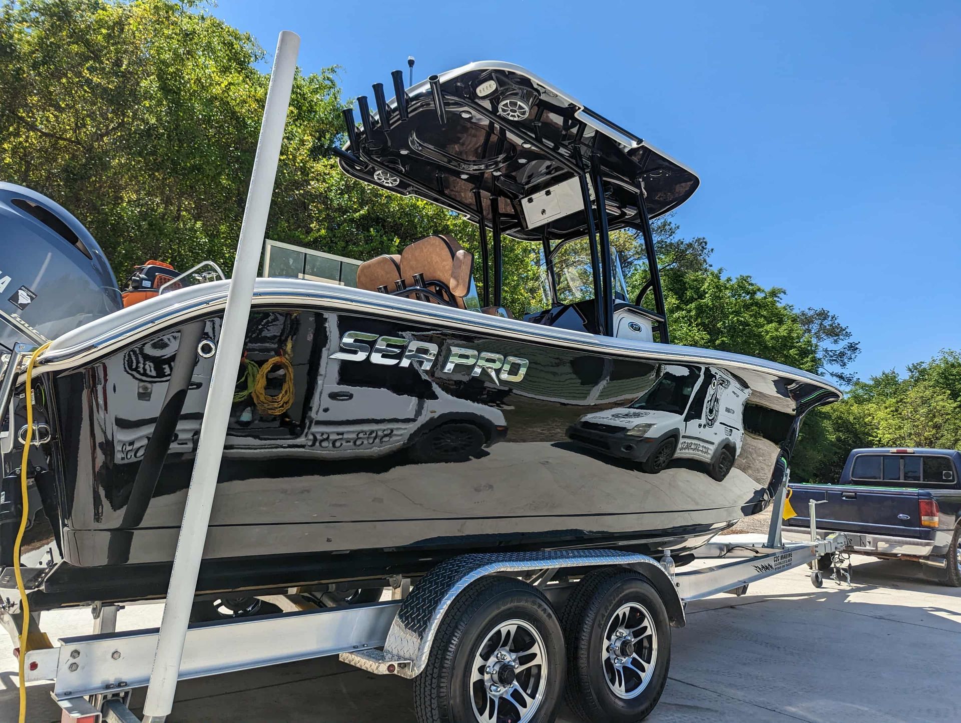 Black Sea Pro boat on a trailer, under a blue sky.