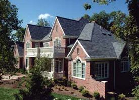 A large brick house with a gray roof