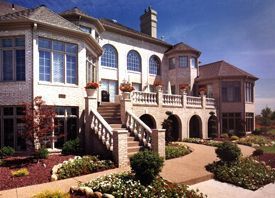 A large white house with stairs leading up to it