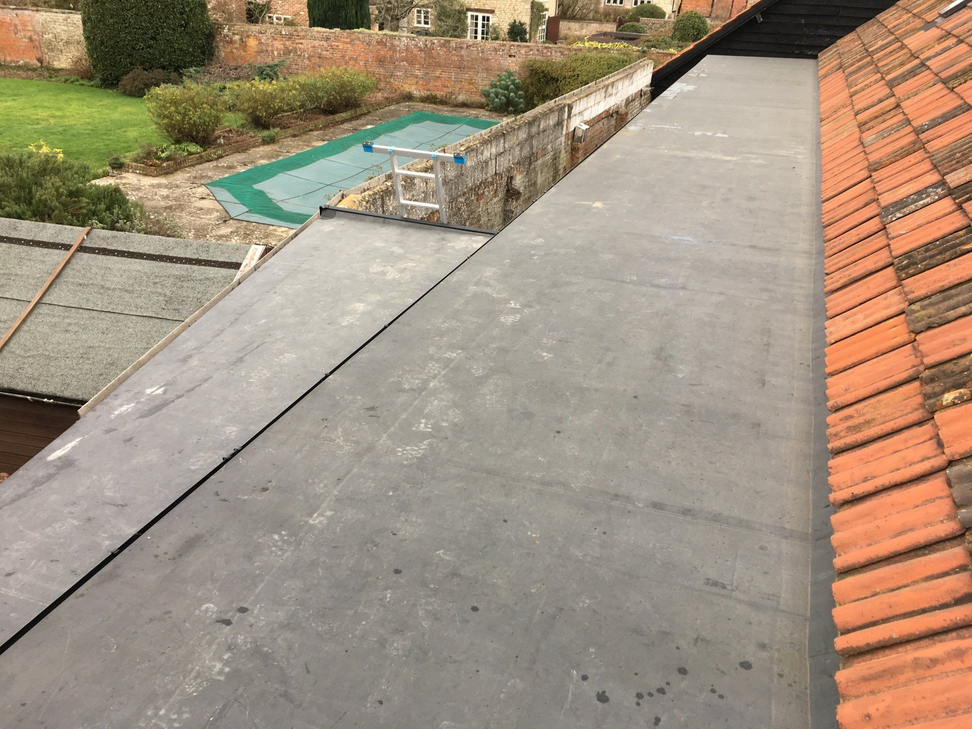 long new flat roof on side of house