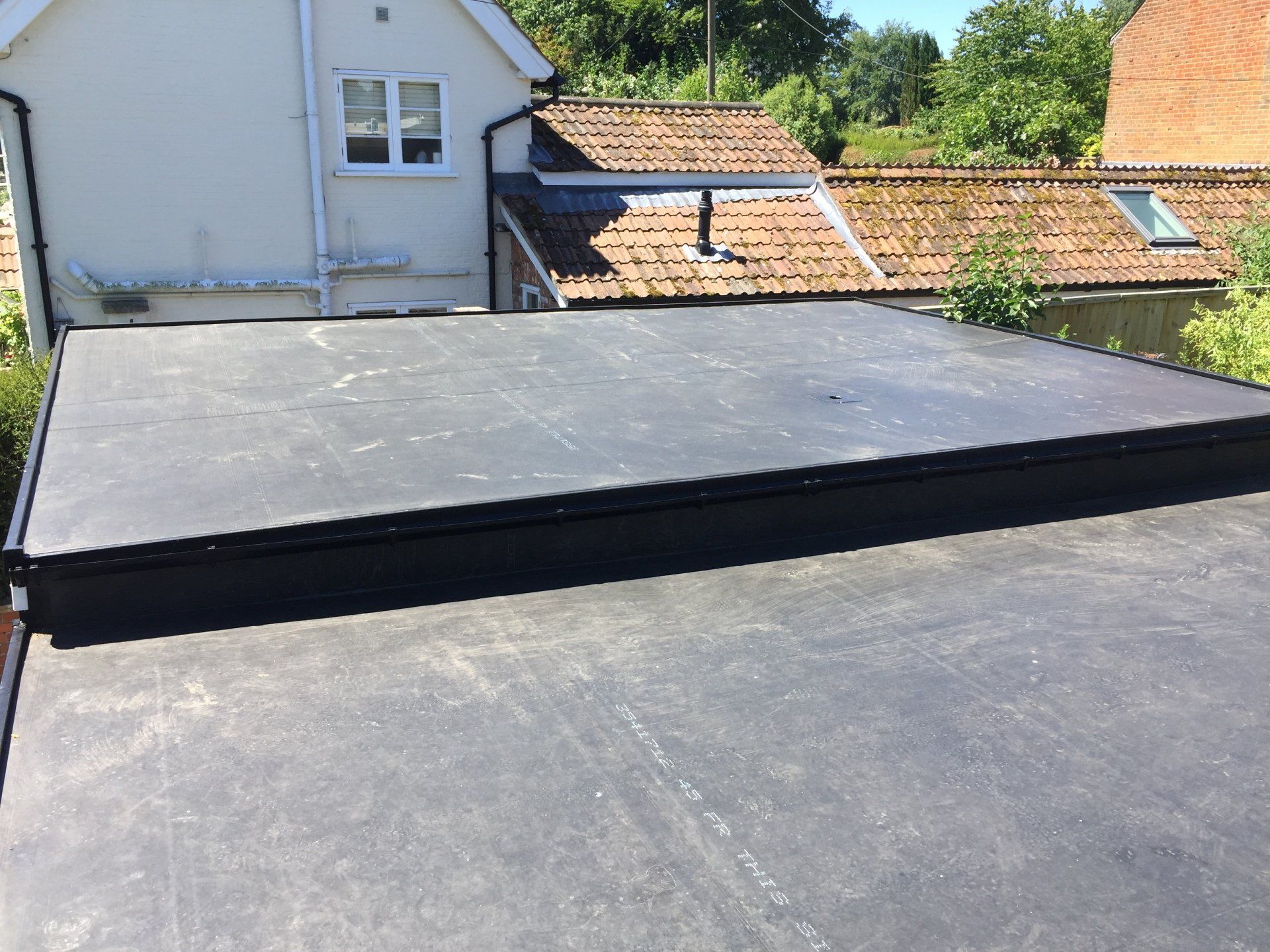 2 old garage flat roofs side by side