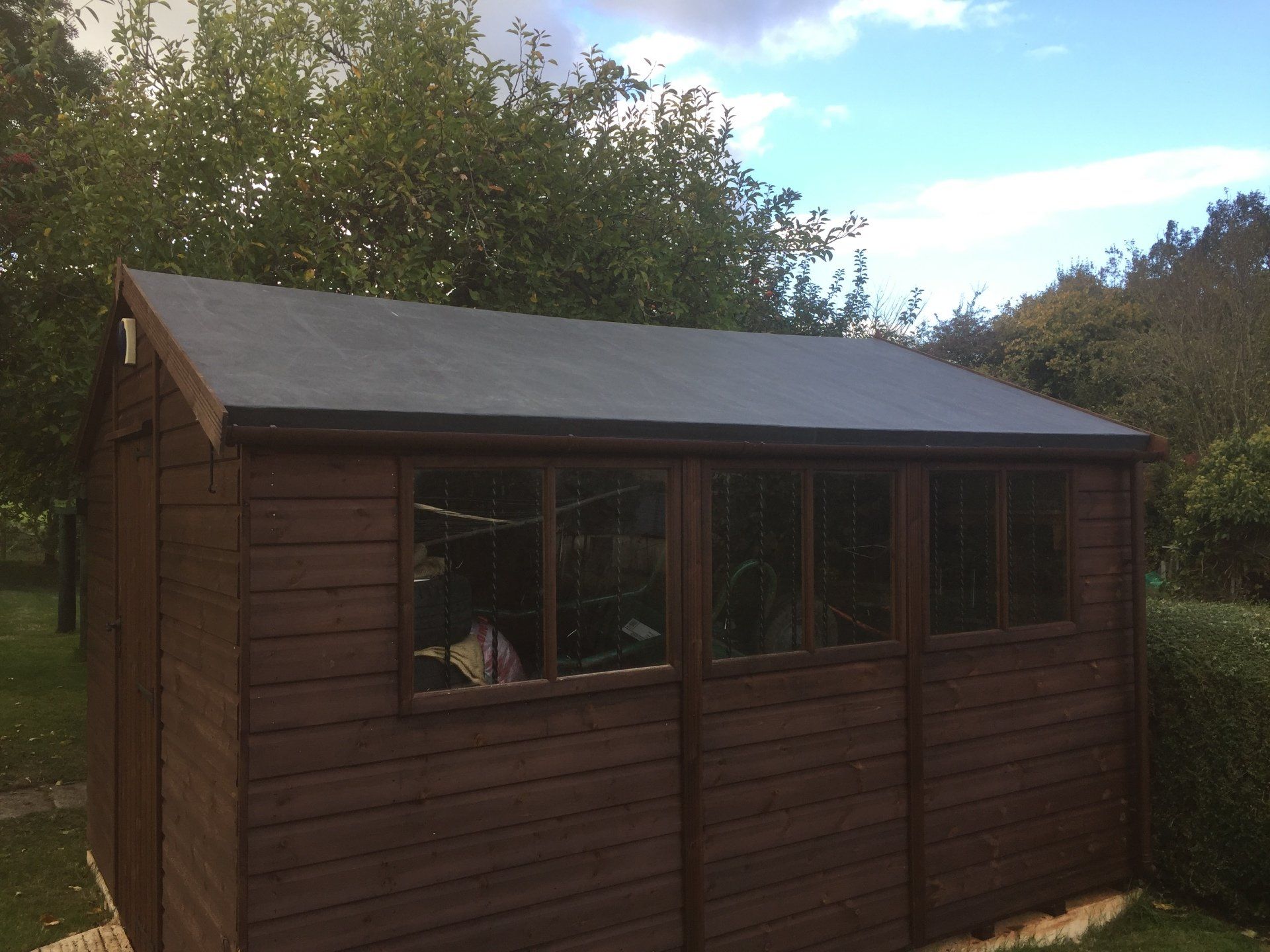 garden shed with new felted roof