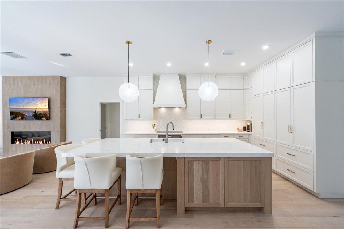 There is a large island in the middle of the kitchen.