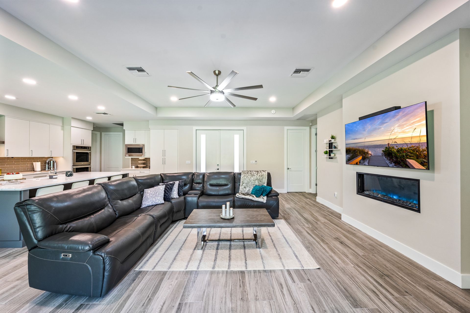 A living room filled with furniture and a flat screen tv.