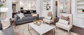 A living room filled with furniture and a coffee table.