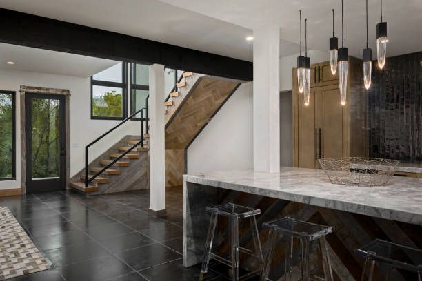 Elegant kitchen with black and white marble countertops, highlighting custom remodeling by Genuine H