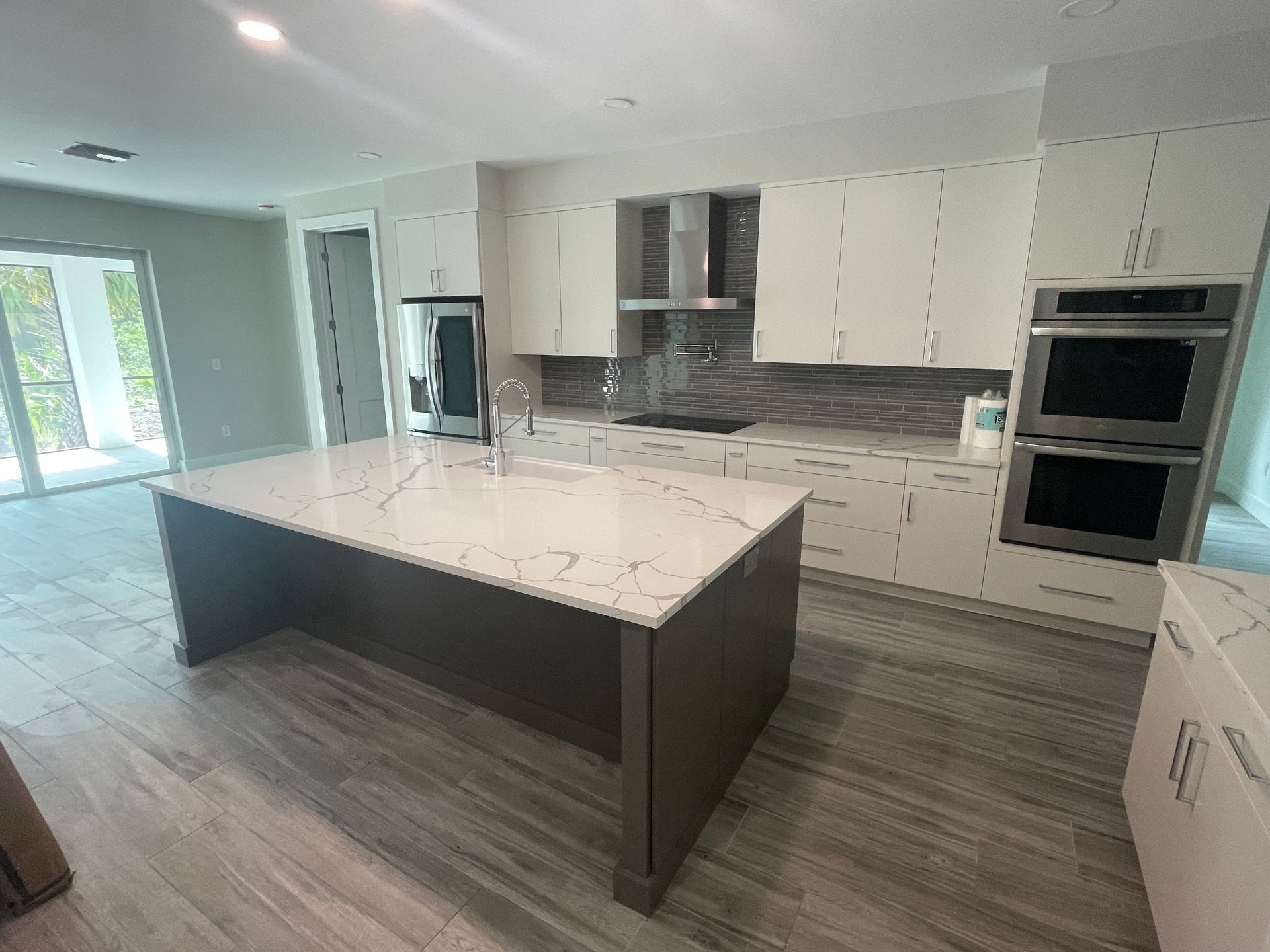 There is a large island in the middle of the kitchen.
