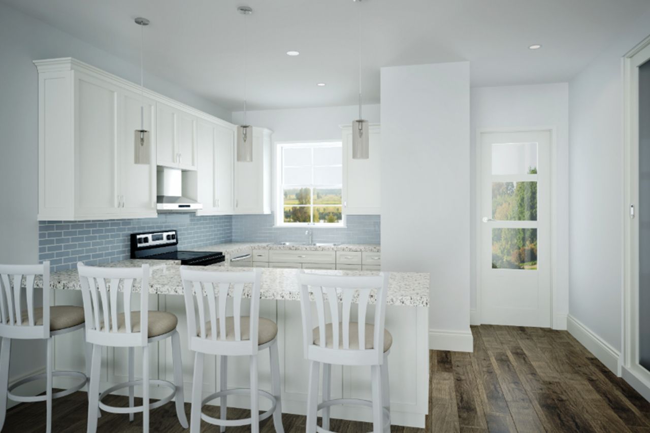 A kitchen with white cabinets and stools and a large island.