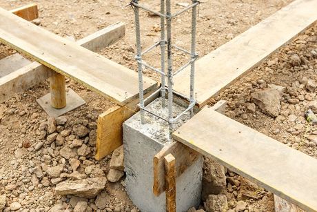 a construction site with a concrete slab and scaffolding