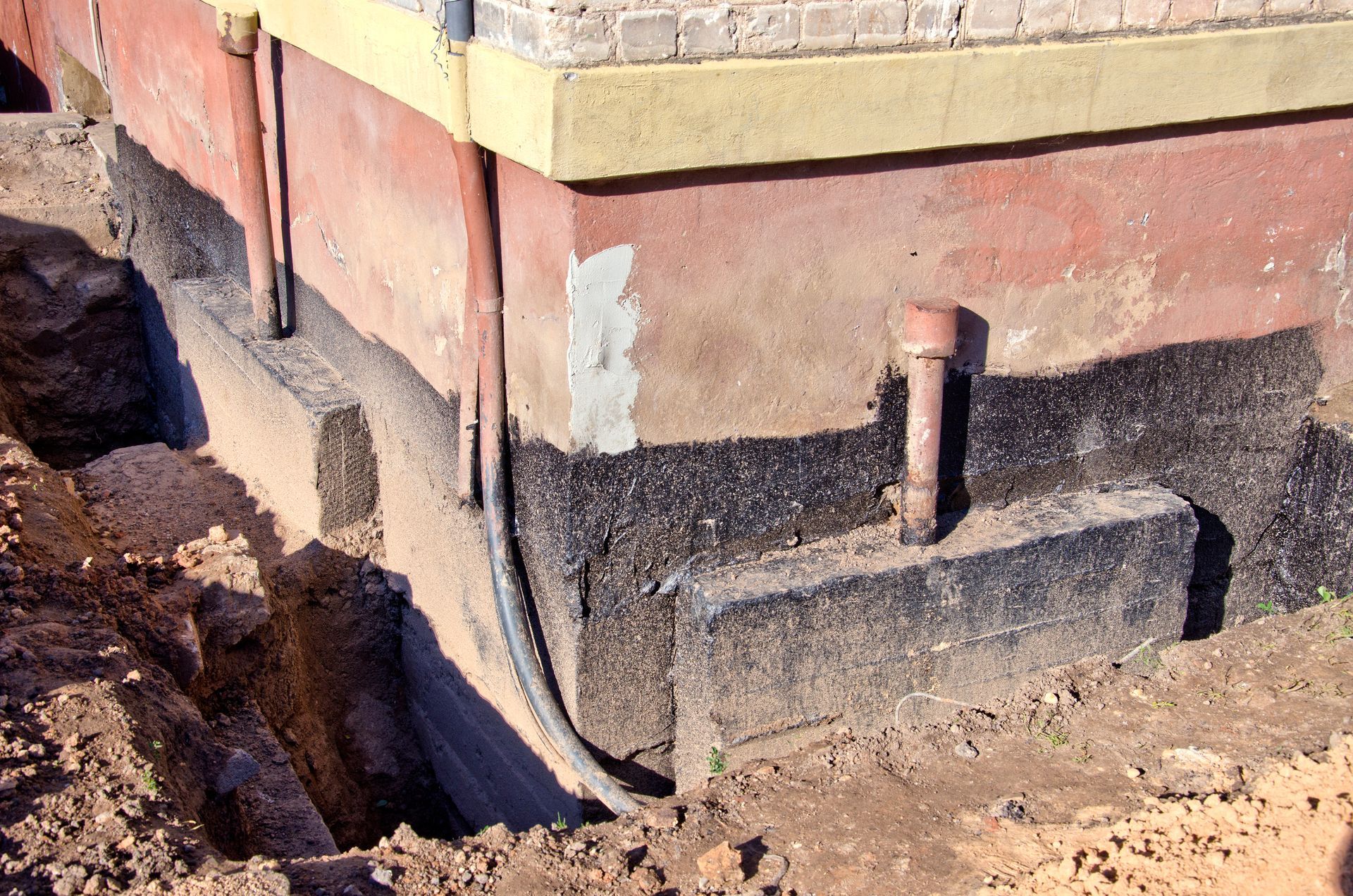 a large brick structure with pipes sticking out of it