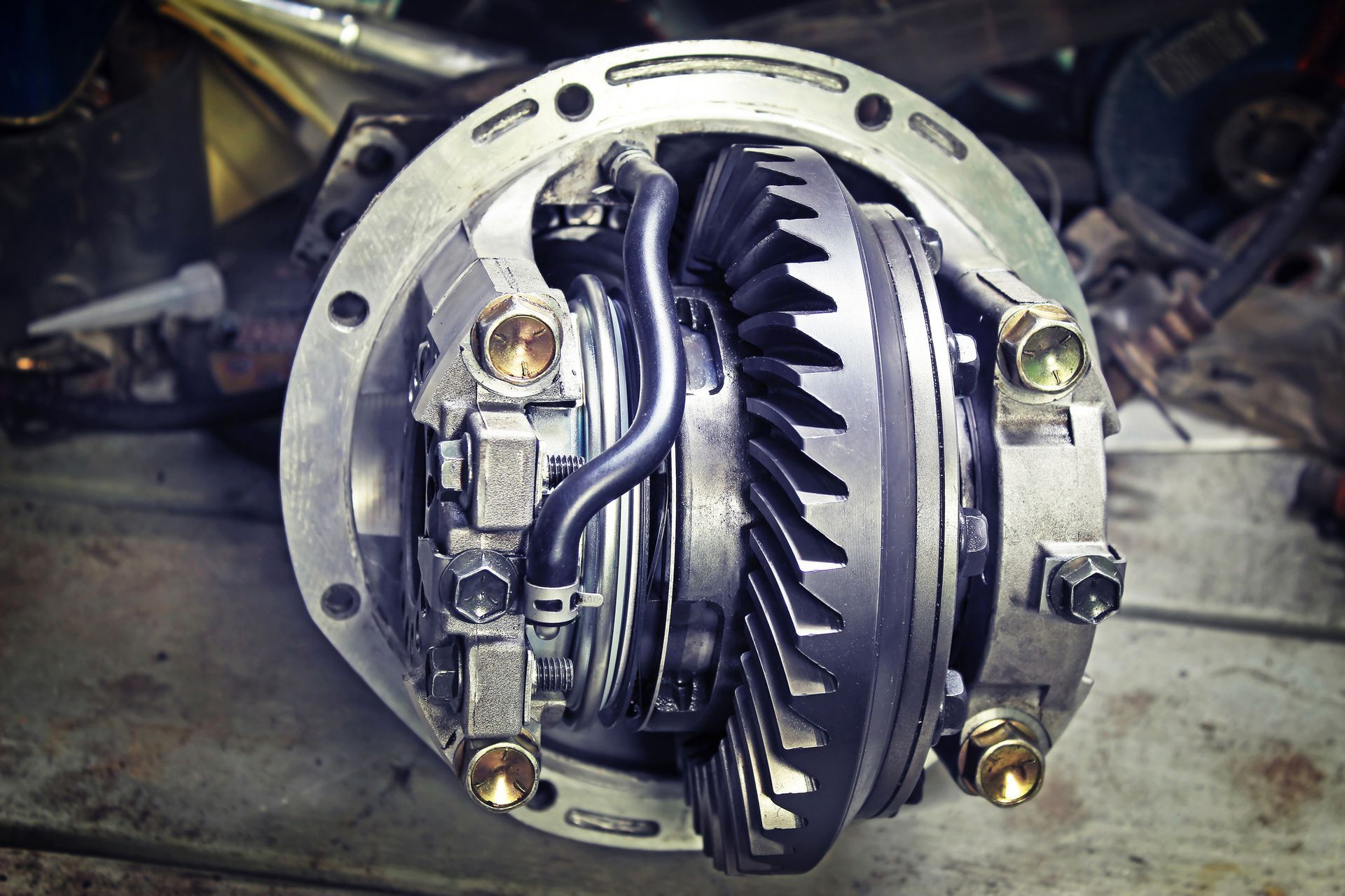 Cutaway view of a car transmission, revealing internal gears and components, metallic and grey.