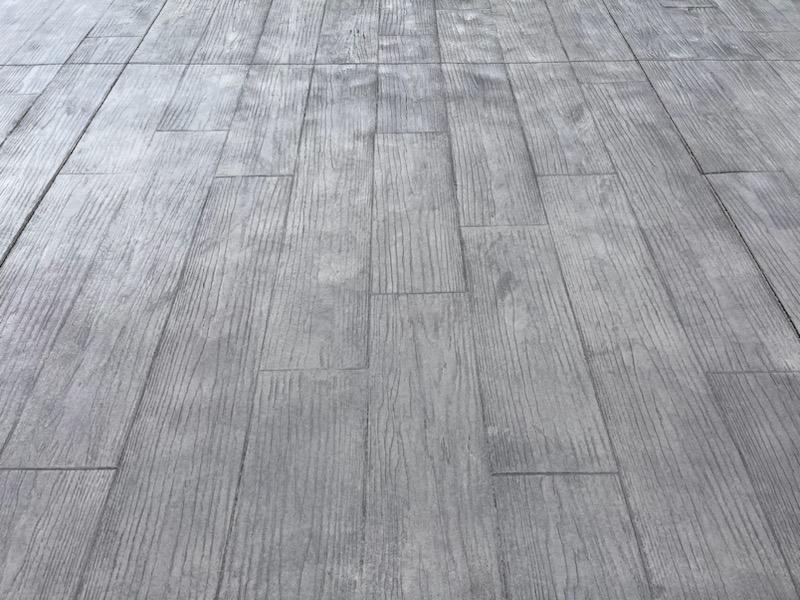 A close up of a concrete floor that looks like wood.