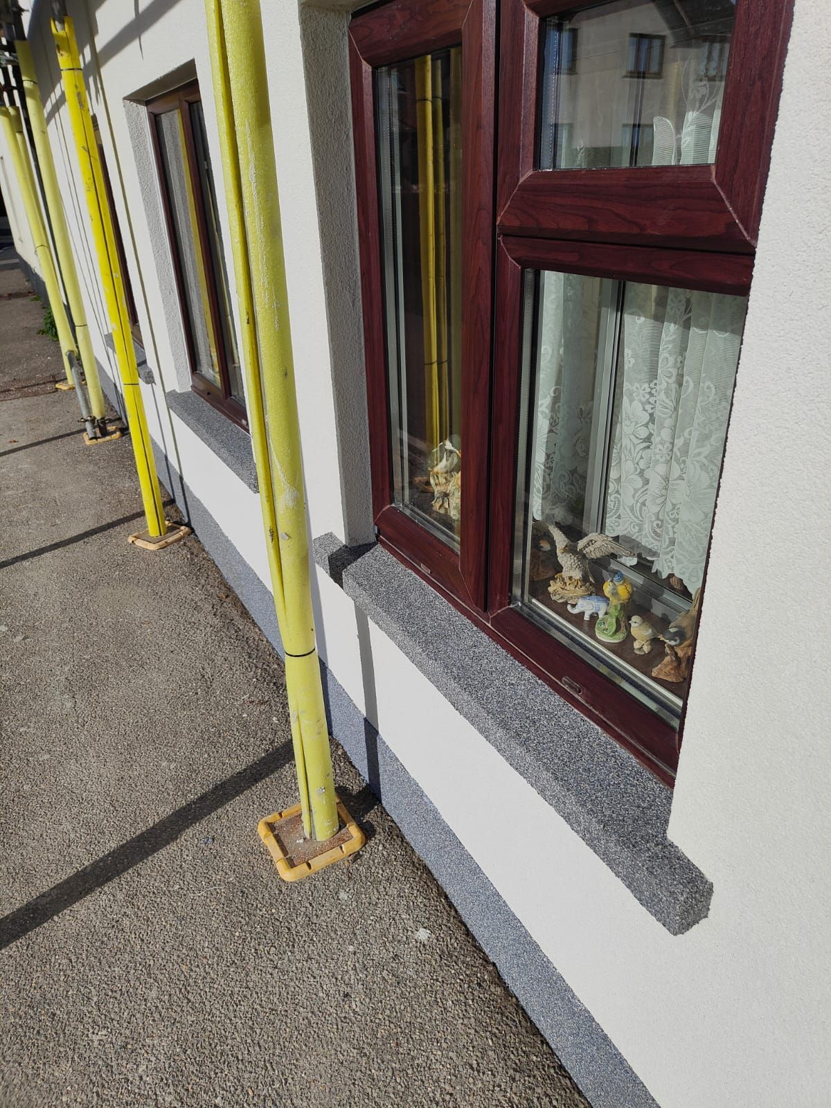 A window on the side of a building with scaffolding around it.
