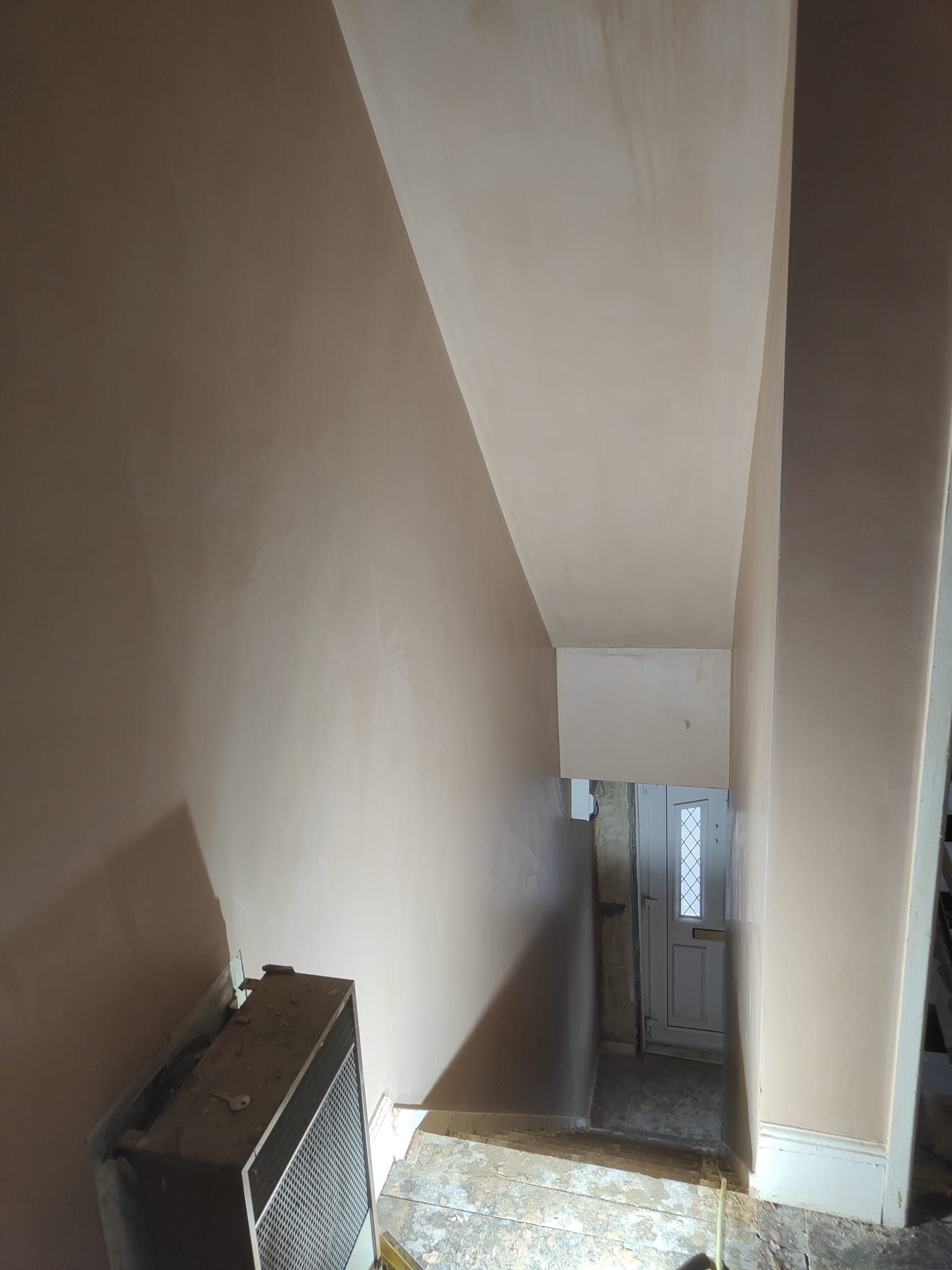 A staircase leading up to a basement in a house.