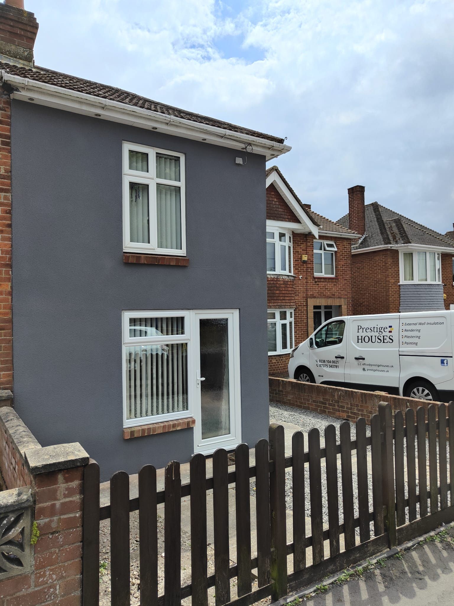 A house with a white van parked in front of it