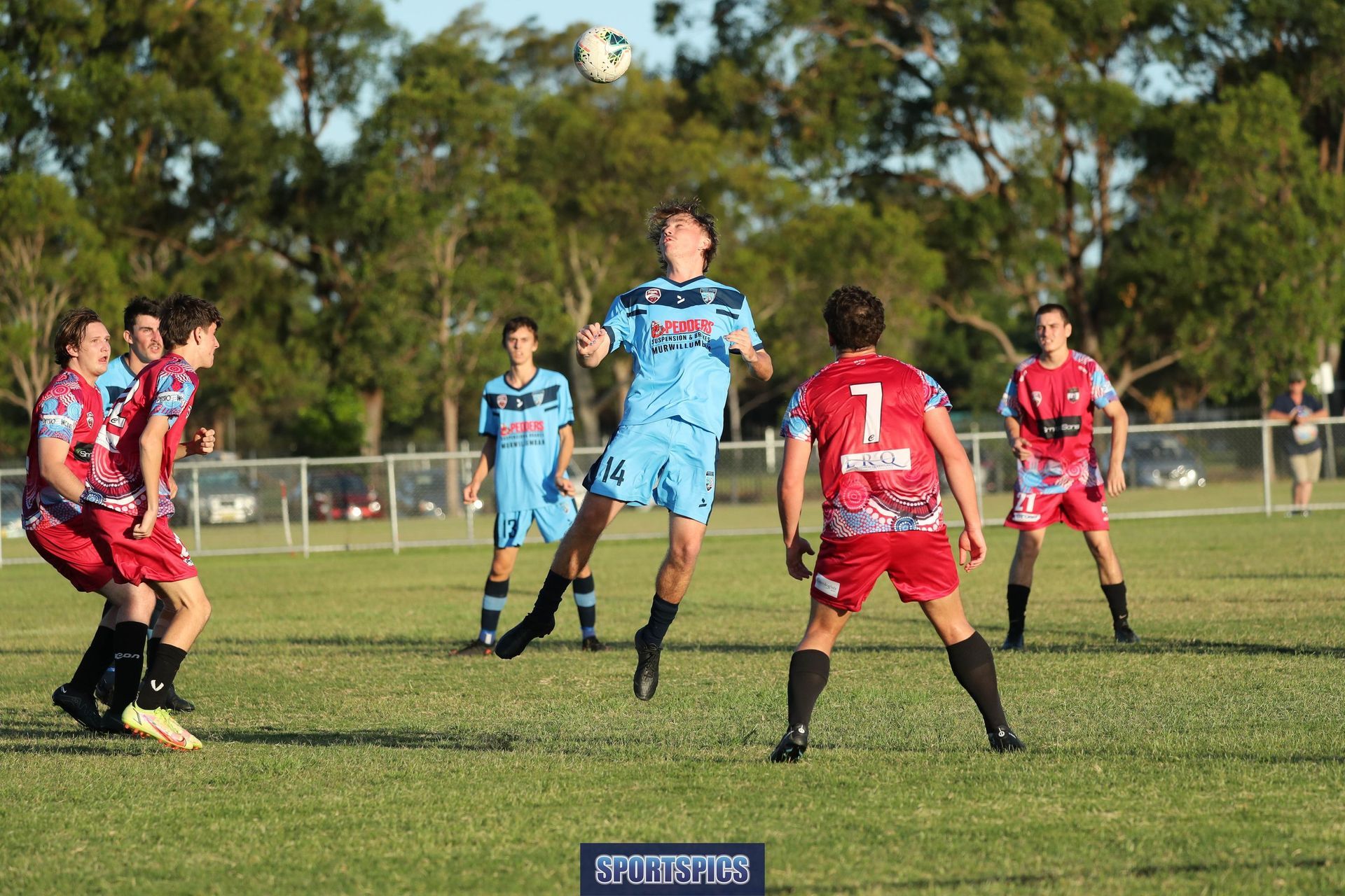 tweed united footballer heading the ball