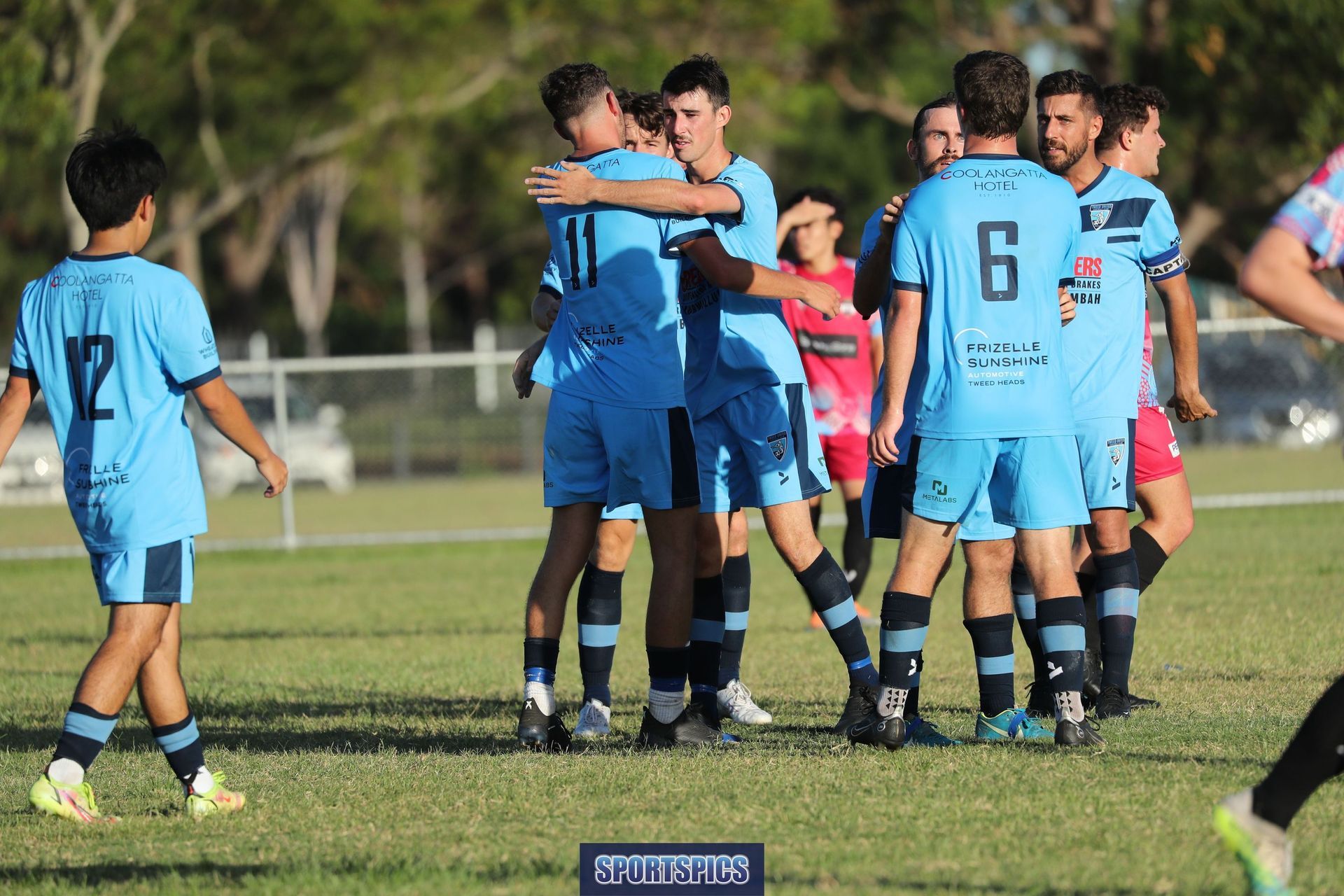 tweed united footballers celebrating a goal