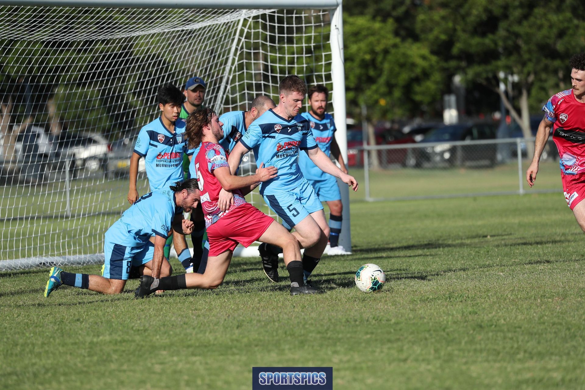 tweed united footballers clearing the ball off the goal line